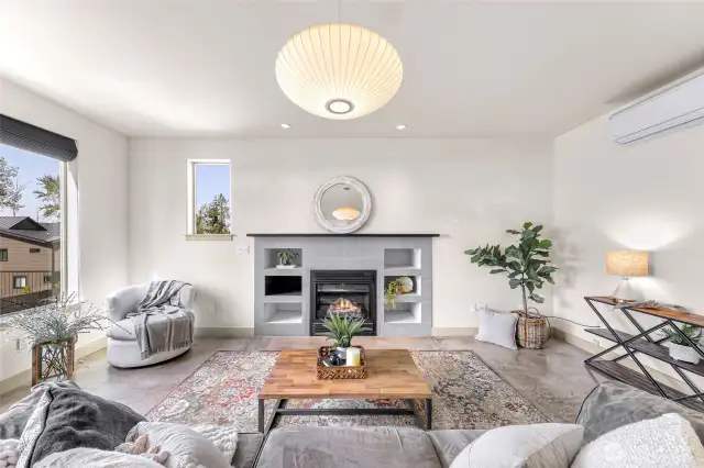Beautiful has fireplace with built-in shelving, TV over the mantle, and wired for speakers in the ceiling.