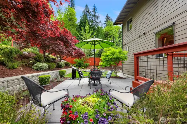 Spectacular private backyard, fully landscaped oasis, a small deck off the living room/kitchen that flows out to a spacious patio with a stone water feature.