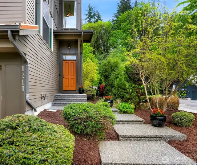 Freshly landscaped grounds, meticulously kept and maintained home! Beautiful and private entrance, to the left is a two-car garage.