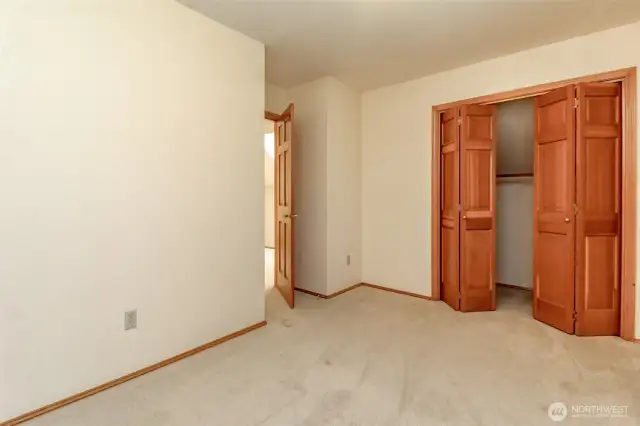 Double closet with solid fir doors.