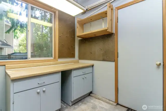Garage workbench with cabinets.