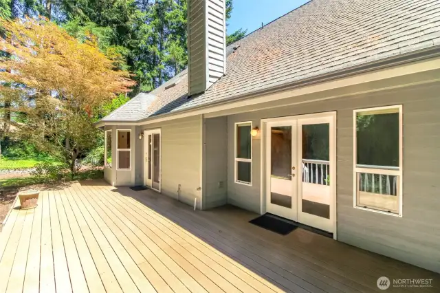 Doors from primary bedroom and great room lead out to this spacious deck.