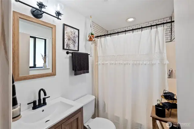 Primary bathroom with subway tiling a great personality