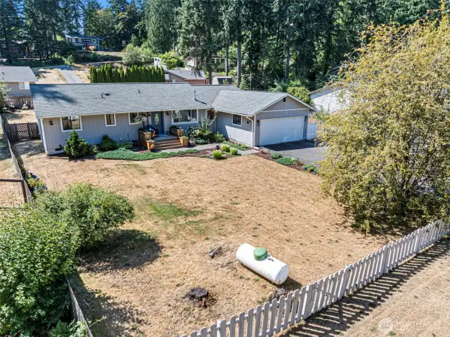 Even the front yard is oversized, level and fenced!