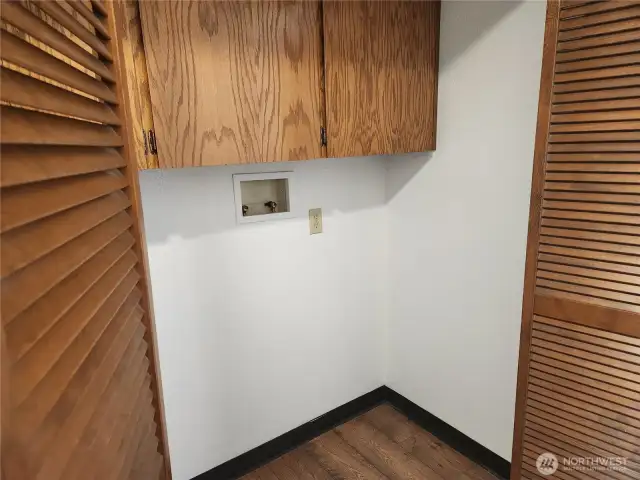 Laundry area with cabinets for storage above the space for your washer & dryer.