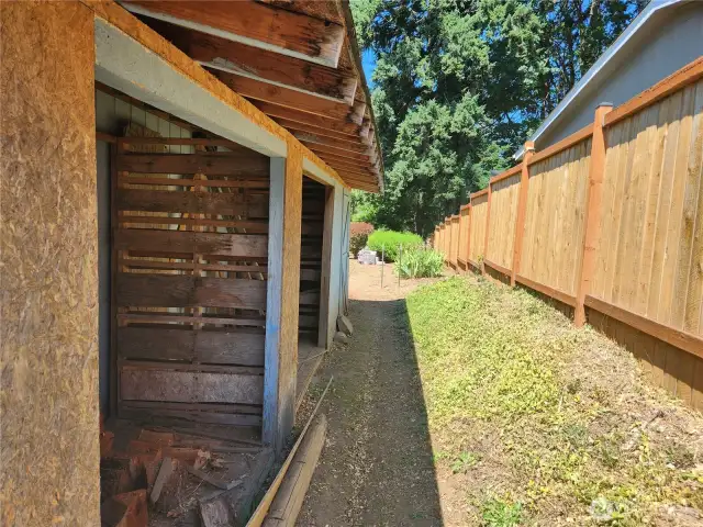 Woodshed off the side of the home, also room to store any tools or lawn equipment.