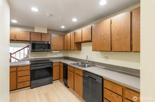 Efficient kitchen has all new high end appliances, including this induction stove..  Bamboo floors in kitchen, dining and hallway entry.