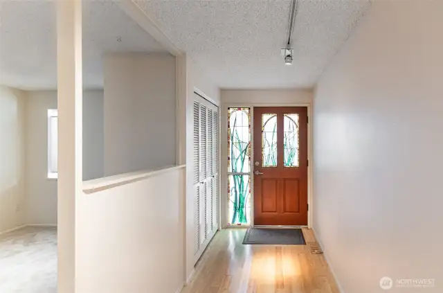 This is a one of a kind artistic feature, custom stained glass door and side window offer privacy and beautiful colored glass detail.  Off to the left, open den or office.  This space could serve many purposes.