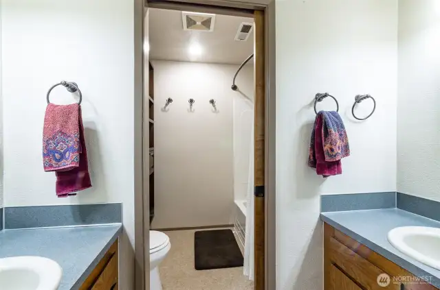 Centrally located on the upper level.  This full bath offers individual sinks and private toilet/bath area.
