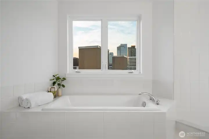 A gorgeous Kohler soaking tub awaits you for that ultimate evening relaxation.