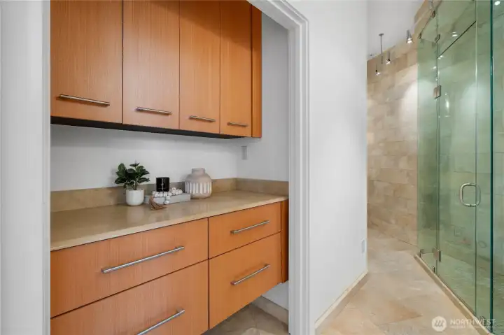 The secondary bathroom offers Steamist steam shower with built in  shelving.