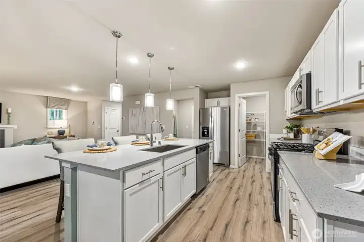 Phots are of the same floor plan in a different community. Finishes may vary.