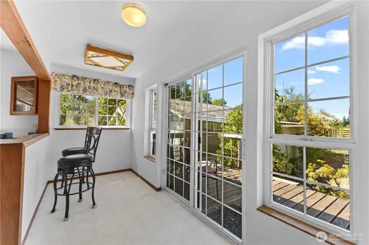 Eating nook with slider to back deck.