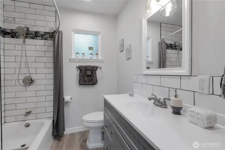 Full Bath With Tile Shower and Quarts Counter Top.