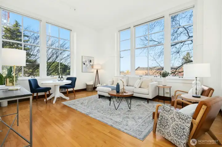 Corner unit provides oversized windows on two walls & dramatic 14-foot ceilings, creating an airy, light-filled living space