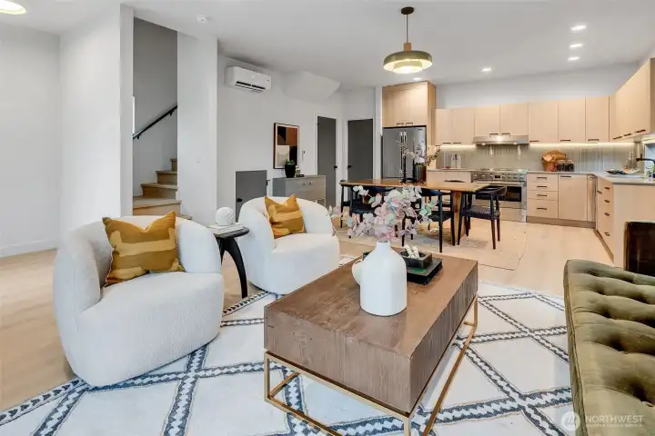 Open main level with stylish finishes, flexible living/dining space & contemporary modern kitchen with high-end appliances & custom-tailored finishes.