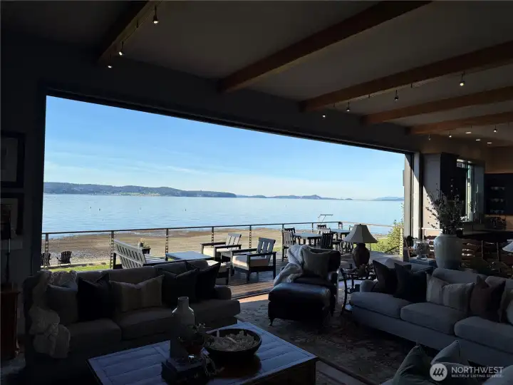 rom your seat beside the fireplace, panoramic views stretch across the sound and north toward Canada — uninterrupted and ever-changing.