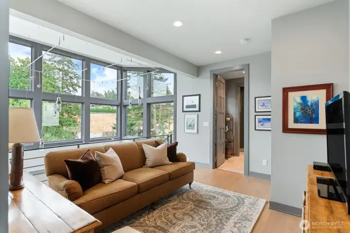 A bright upper-level bonus room ideal for a media lounge, reading retreat, or additional gathering space.