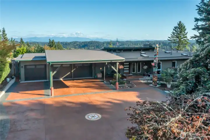 Front view showing RV parking and covered carport. Top quality roof