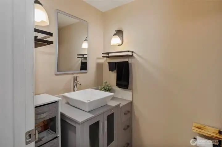 The updated half bath on the main floor provides convenience for all.