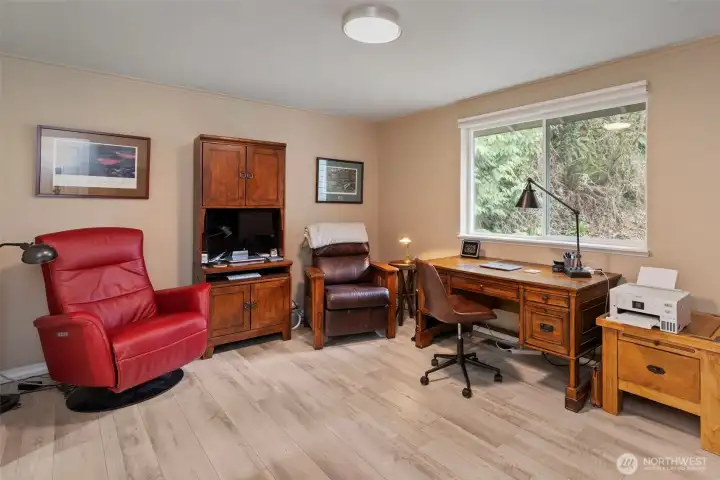 The second bedroom suite on the main floor could double as a den, office, hobby room or guest space. It enjoys a full bath so could be an option for multi-generational living.