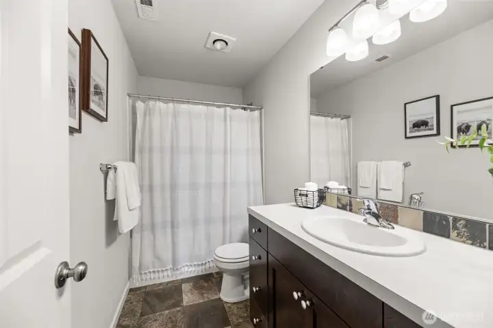 Upstairs shared full bath.