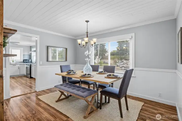 Bright dining room located just off the kitchen, ideal for effortless entertaining