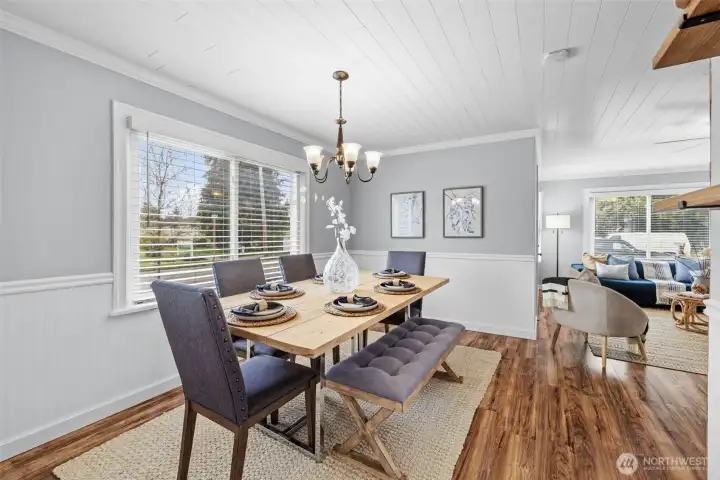 Kitchen view showcasing seamless flow to dining room and living room