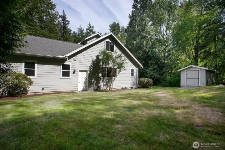 West side with garden Shed. West side with garden Shed.
