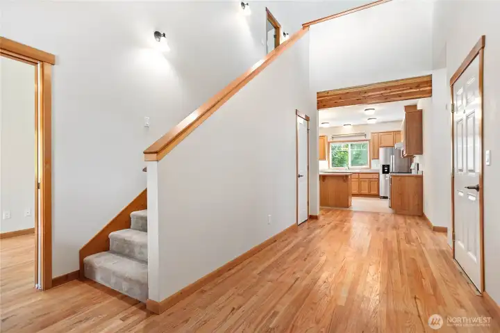 Entry. To the left is the Office/Den or convert to 4th Bedroom. Garage door to the right. Laundry, Primary, and 1/2 Bathroom down the hall to the right. Kitchen and Living room and dining straight ahead. Up the stairs are 2 Bedrooms, a open living area, a full Bathroom, and a unfinished storage area or? Entry. To the left is the Office/Den or convert to 4th Bedroom. Garage door to the right. Laundry, Primary, and 1/2 Bathroom down the hall to the right. Kitchen and Living room and dining straight ahead. Up the stairs are 2 Bedrooms, a open living area, a full Bathroom, and a unfinished storage area or?