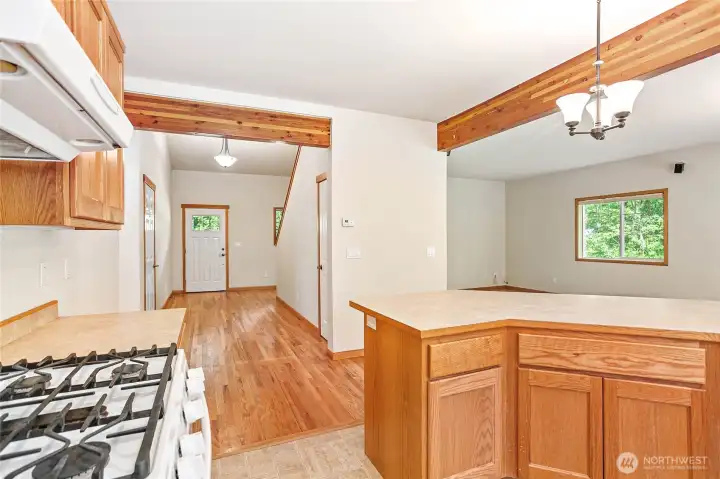 Looking back at the Entry. Left hallway goes to the Laundry and 1/2 Bath and the Primary. Door to the left goes into the garage. To the right by the stairs is the Office/Den. Looking back at the Entry. Left hallway goes to the Laundry and 1/2 Bath and the Primary. Door to the left goes into the garage. To the right by the stairs is the Office/Den.