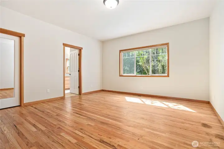 Large Primary Bedroom. Far door is the en suite. Door to the left is the walk-in Closet. Large Primary Bedroom. Far door is the en suite. Door to the left is the walk-in Closet.