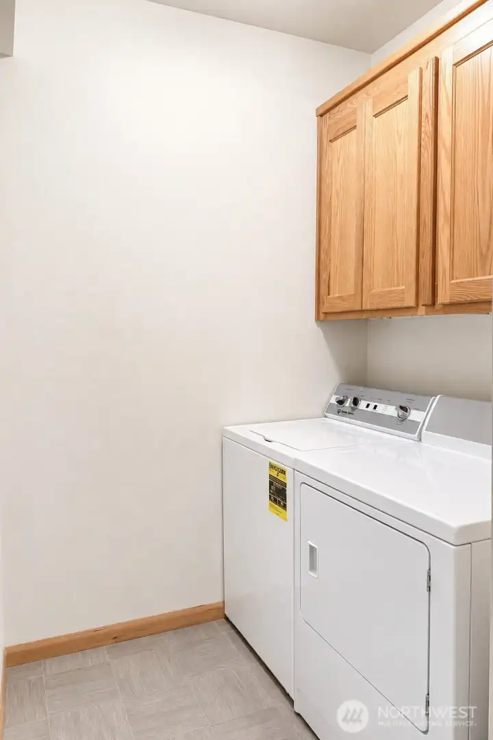 1/2 Bathroom/Laundry Room in the hallway to the Primary Bedroom 1/2 Bathroom/Laundry Room in the hallway to the Primary Bedroom
