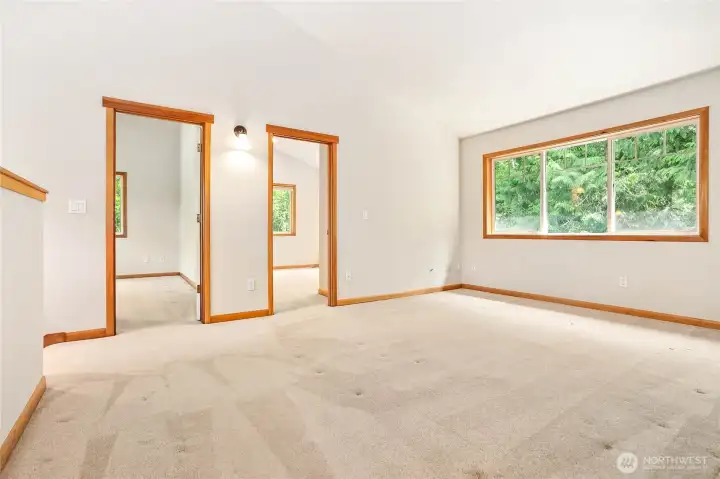 Upstairs Living room. Bedrooms 2 and 3. Stairs to the left and full bath and unfinished room behind photographer. Upstairs Living room. Bedrooms 2 and 3. Stairs to the left and full bath and unfinished room behind photographer.
