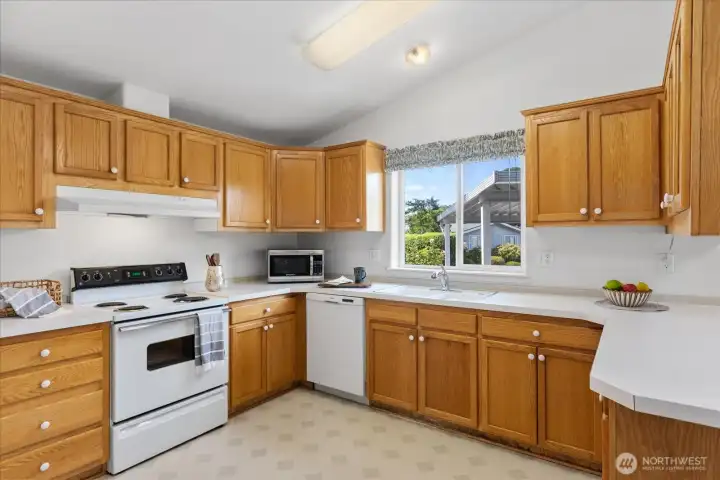 Kitchen features an abundance of storage space.