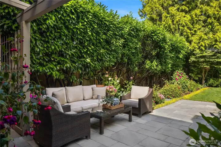 A lush, private backyard offers plenty of room to relax, garden, or enjoy summer evenings. A lush, private backyard offers plenty of room to relax, garden, or enjoy summer evenings.
