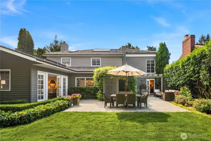 Expansive lawn and mature landscaping create a serene outdoor oasis. Expansive lawn and mature landscaping create a serene outdoor oasis.