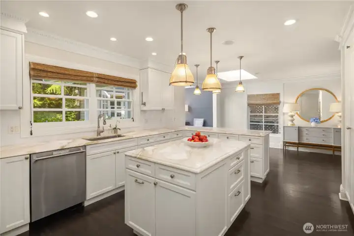 The kitchen features generous counter space, custom cabinetry, and an inviting layout for gathering. The kitchen features generous counter space, custom cabinetry, and an inviting layout for gathering.