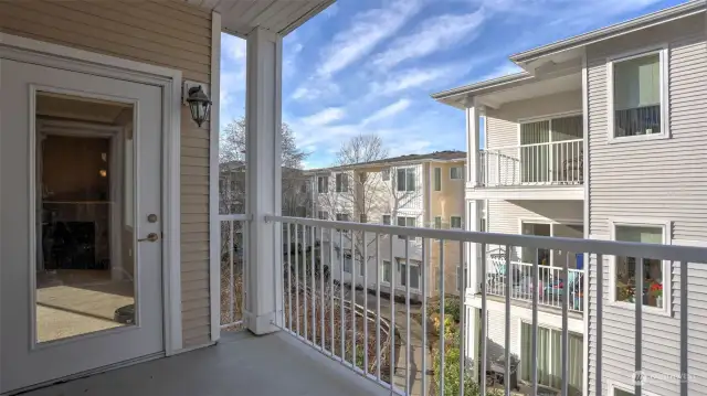 Step onto the private deck, accessible from both the living room and primary bedroom, offering a seamless indoor-outdoor living experience.