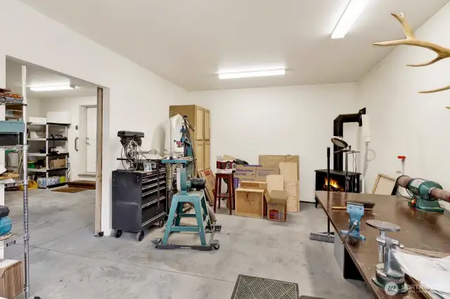 work shop area with gas fireplace