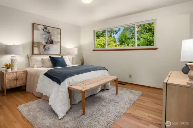 Primary ensuite bedroom on the main floor. Located in the NE corner of the home.