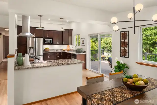 Walk out access from kitchen and dining to newer deck.
