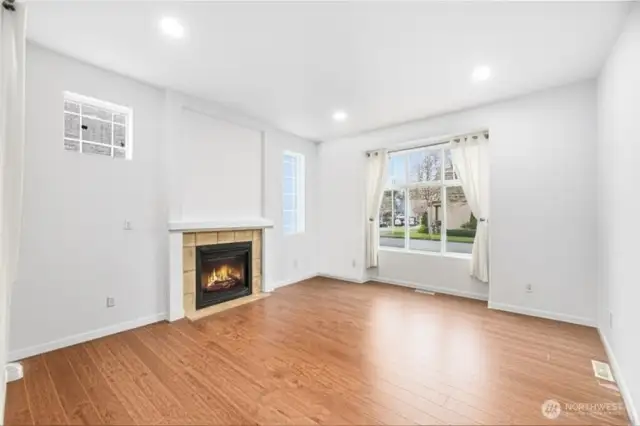 GREAT ROOM  Picture window  Gas fireplace with tile surround & niche above