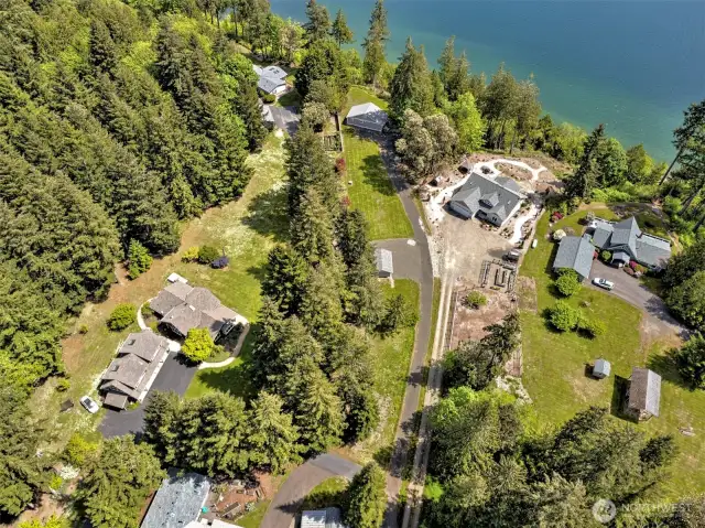 Aerial shows surrounding neghborhood of nice homes.