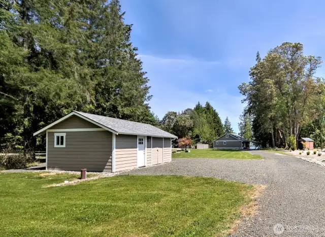 Private well and well house with additional double doors to roomy storage space.