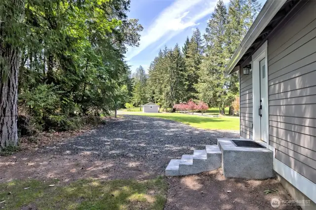 Entry and looking west toward the driveway.