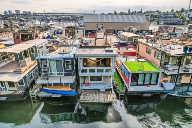 Located on the coveted outside dock with a floating dock off the back—perfect for launching kayaks, paddleboards, or mooring a small boat. Custom racks line the side for your gear, keeping adventure close at hand. Soak in the serenity from your private rooftop deck or unwind as the fully opening Euro-style window invites the sights, sounds, and breeze of Lake Union inside. Here, lakefront living meets urban energy—whether you’re savoring peaceful mornings or catching sunsets with a glass in hand, this floating home is your front-row seat to the Seattle lifestyle.