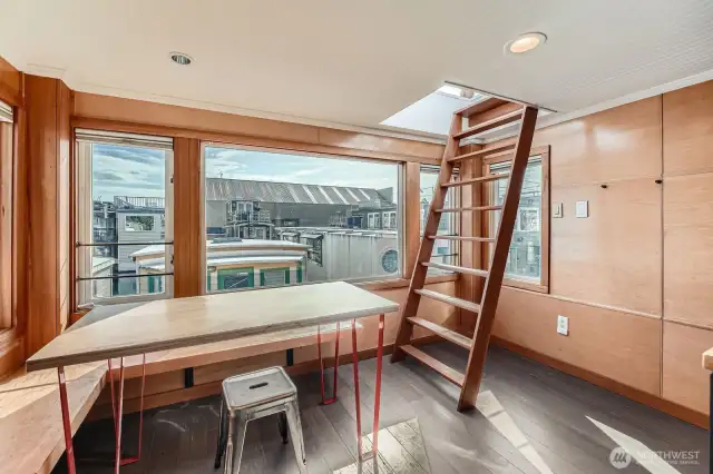 The ladder to the right takes you to the rooftop deck.