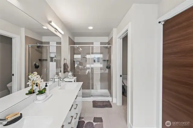 Double sinks and beautiful shower.