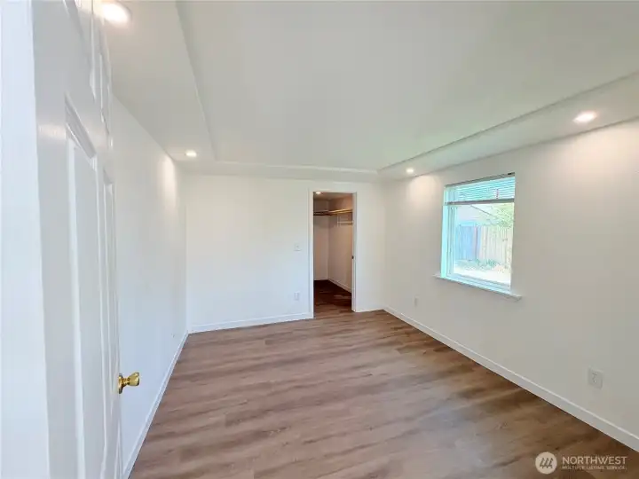 Primary Bedroom with a walk in closet